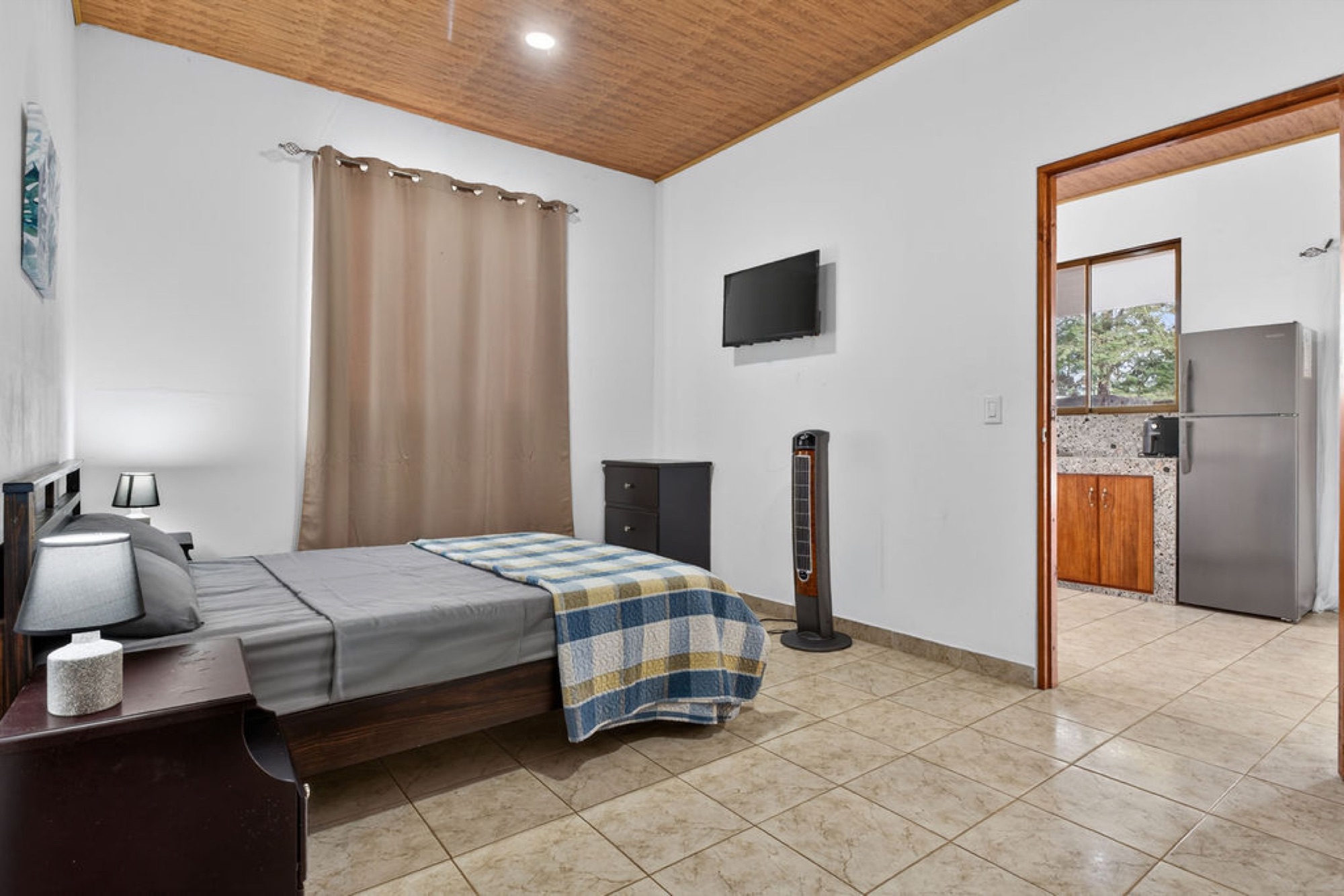 Unit interior with kitchenette beyond
