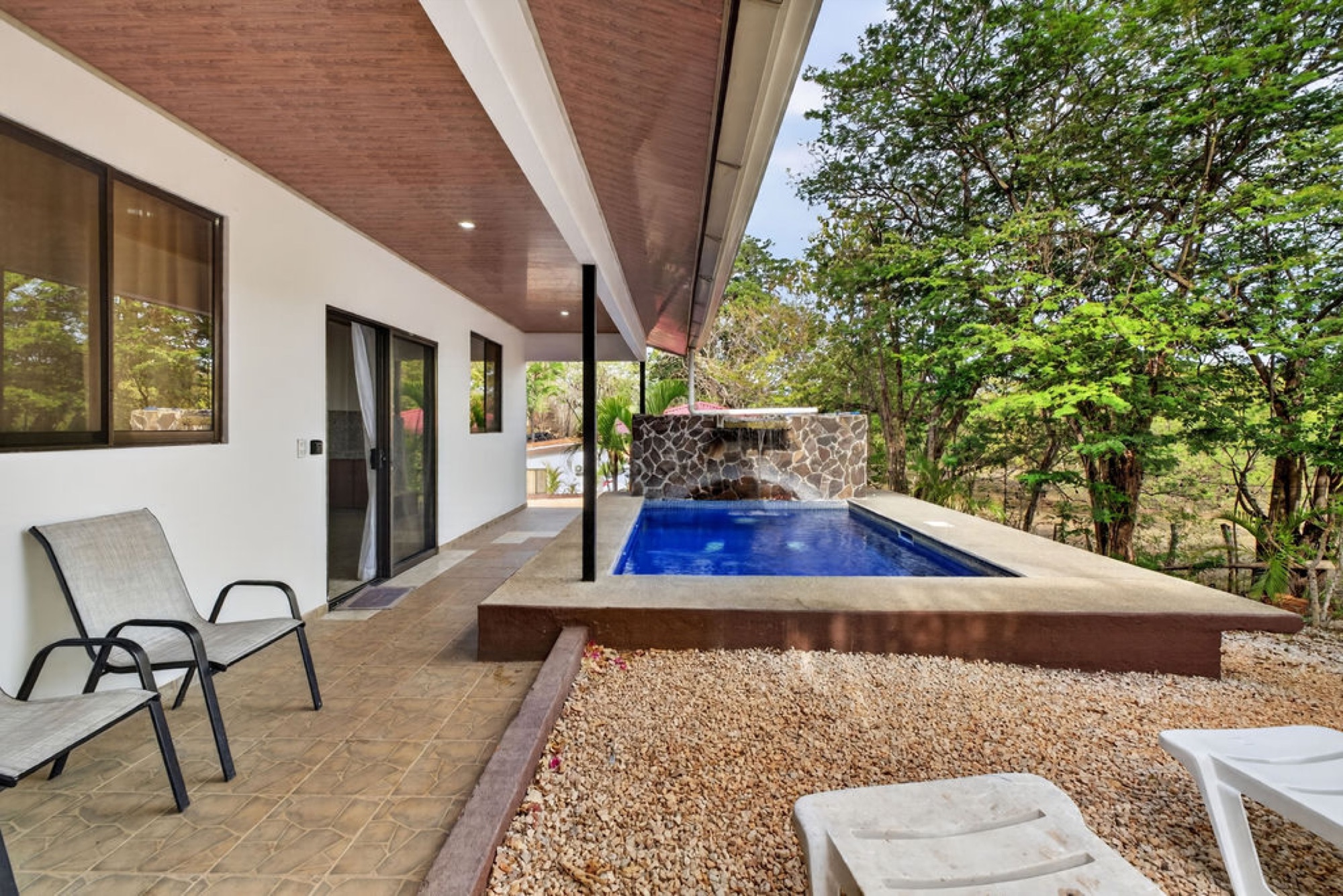 Terrace seating overlooking pool and gardens