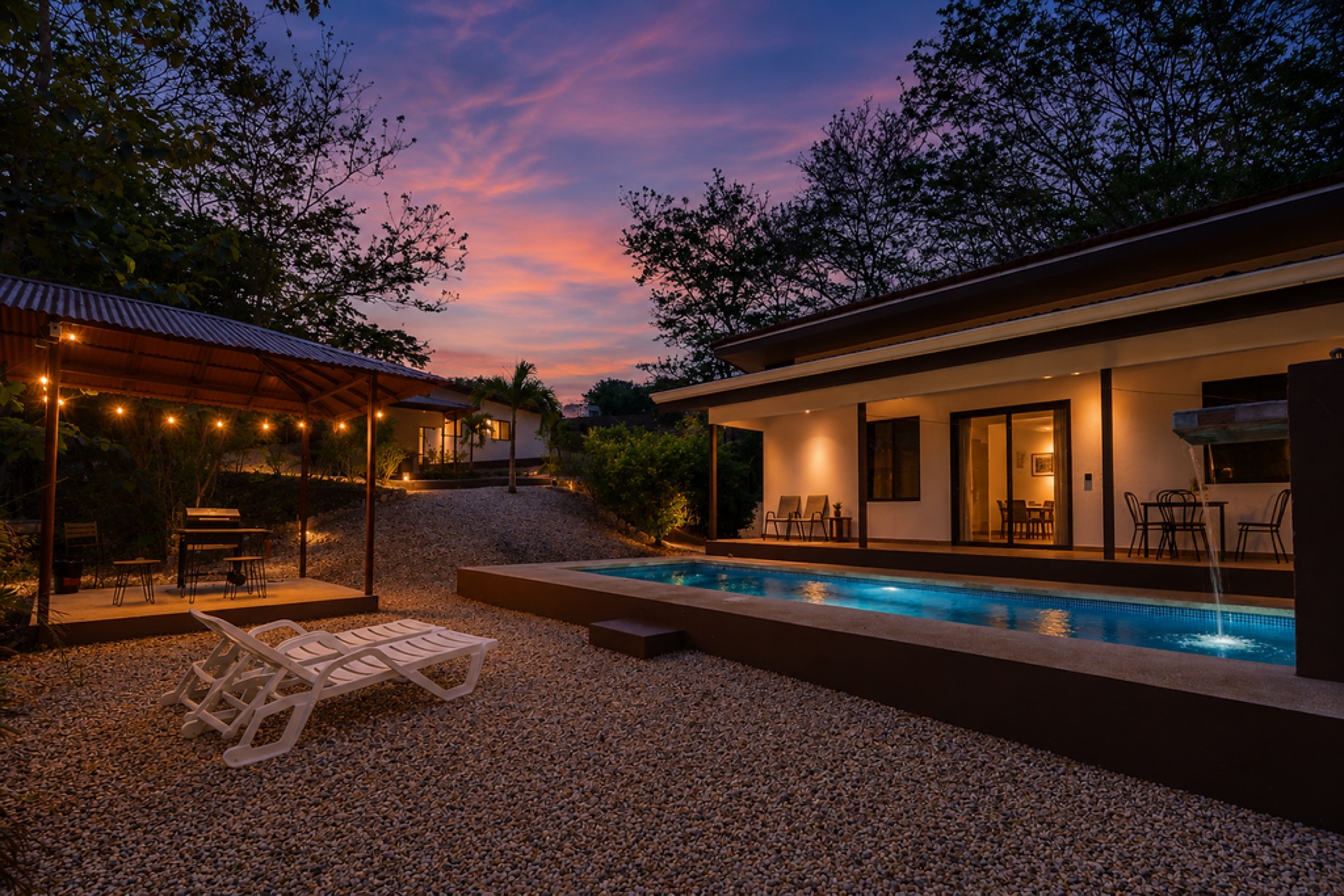 Sunset over the pool and BBQ rancho