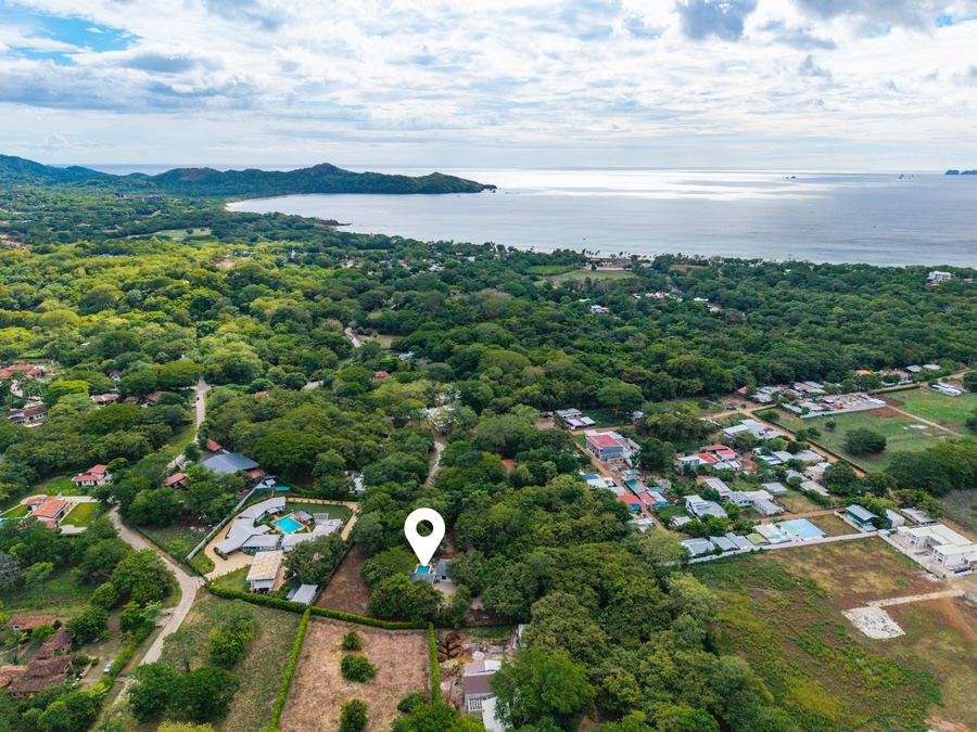 Aerial view toward the Pacific — the property sits minutes from the coastline