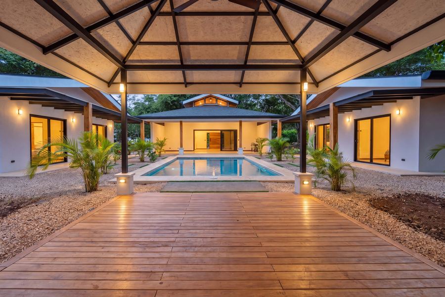 Inside the rancho — vaulted hardwood ceiling and pool-front deck