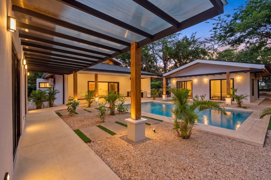 Covered walkway connecting the suites along the pool