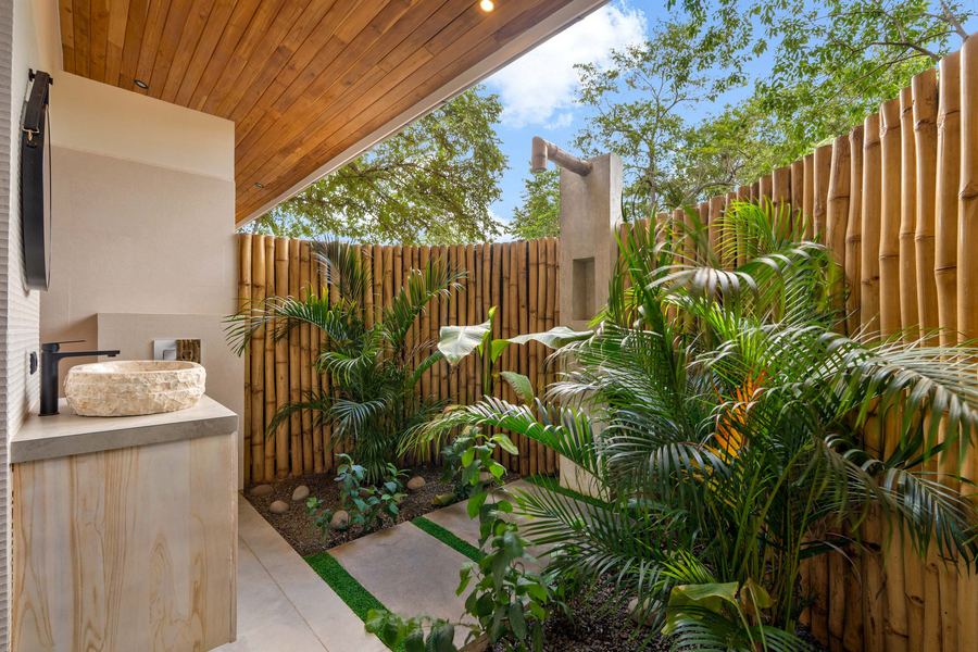 Private outdoor garden bath with tropical planting — a Balinese signature